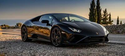 Lamborghini Huracán — black supercar on a coastal road