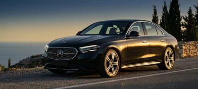 Mercedes E-Class AMG — black sedan on a coastal Greek road