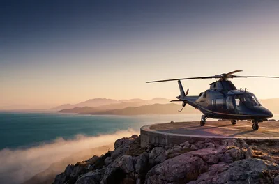 Dark helicopter on misty cliff